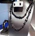 36 inches of beautiful peacock colored freshwater pearls with stud earrings and bracelet Multicolored pearls in shades black/blue