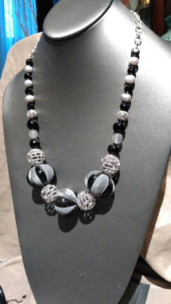 Bone.    Black, Gray & Silver 3 piece jewelry suite