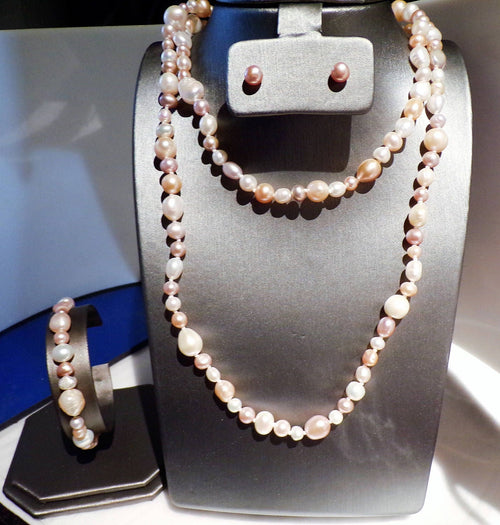 3 foot of multi colored freshwater pearls with stud earrings and matching bracelet
