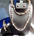 3 foot of multi colored freshwater pearls with stud earrings and matching bracelet